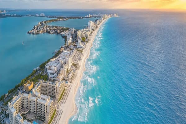 Luxury beachfront hotels overlooking the turquoise Caribbean Sea in Cancun