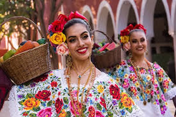 Colorful traditional Mexican celebration with dancers in folkloric costumes
