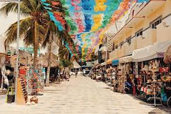 Vibrant street scene in downtown Cancun with local shops and pedestrians